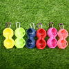 Durable 2-Ball Peanut Shape Silicone Golf Ball Holder, with carabiner clip for easy carrying.