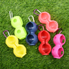 Durable 2-Ball Peanut Shape Silicone Golf Ball Holder, with carabiner clip for easy carrying.